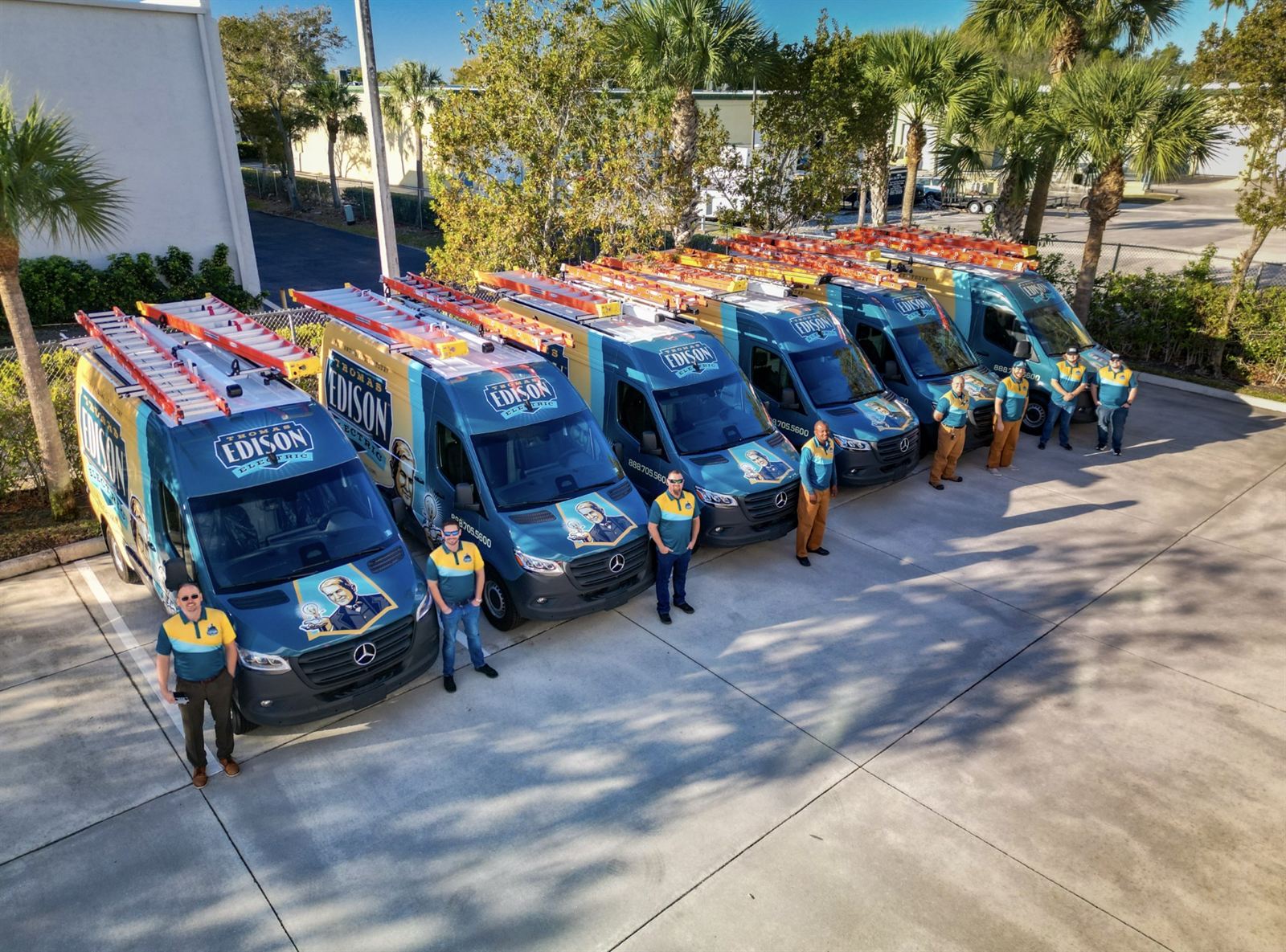Thomas Edison Electric Clearwater service fleet — branded company vans dispatched daily across the metro.